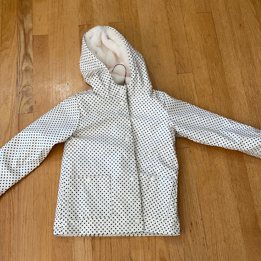 White and black snap front rain coat fur lined so soft hooded and 2 pockets